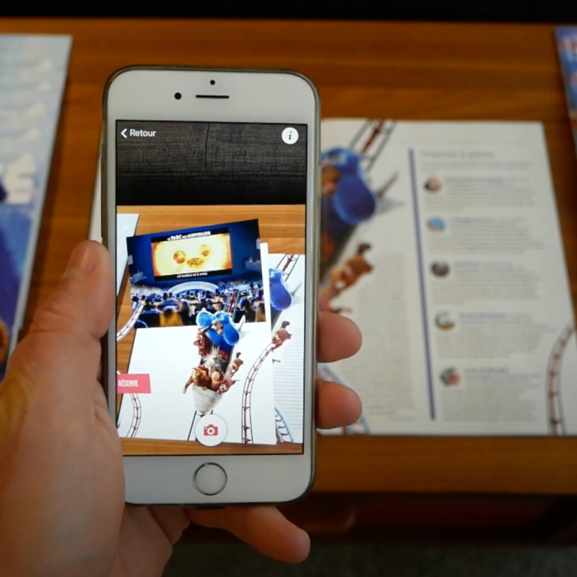 ARGOplay connects printed matter with the digital world, A smartphone screen displaying the printed catalog and increases, characters from the movie Ratatouille